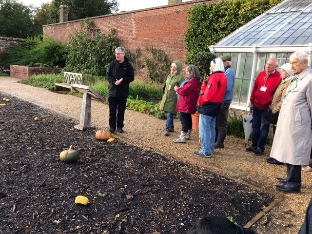 Toby explains the planting of the beds in the walled garden